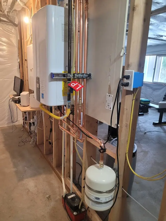 Licensed plumber repairing a kitchen sink in De Soto