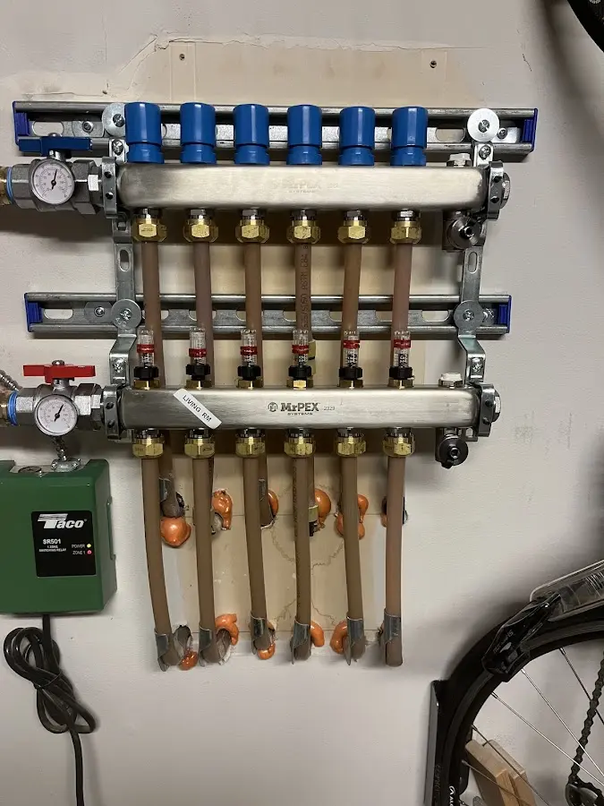 Plumber performing Water Heater Repair at a residential property in De Soto